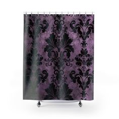 a shower curtain with purple and black designs on it