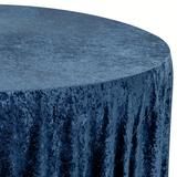 a round table covered in blue velvet