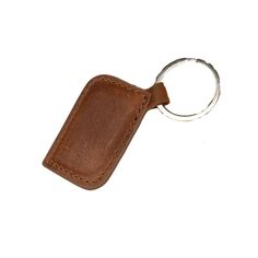 a brown leather keychain with a metal ring