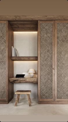 a room with some shelves and a bench in it's center, next to a desk