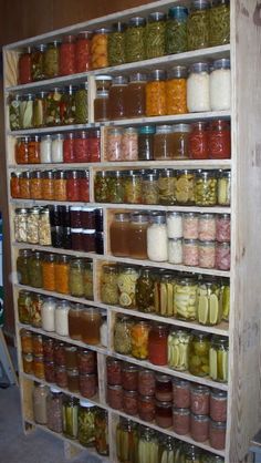 a shelf filled with lots of different types of jars