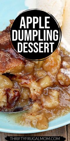 an apple dumpling dessert on a blue plate with a spoon and ice cream in the background