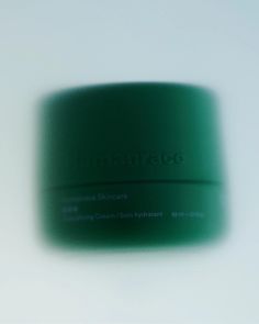 a green container sitting on top of a white table