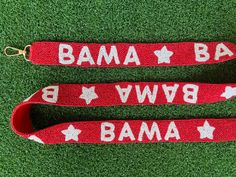 The perfect way to rep your school against opposing teams at football games or every day around campus! Our new and improved adjustable beaded bag strap has finally launched! Gently slide the buckle to customize the strap to the length of your choosing The BAMA strap is made of red and white glass beads hand sewn bead by bead with an added star pattern and attached to a matching red fabric. -Beaded Strap has a width of 1 1/2 inches.  -At full length the bag strap is 4 feet long with an additiona Red Detachable Bag Strap For Daily Use, Red Bags With Detachable Strap For On-the-go, Red Detachable Adjustable Bag Strap, Red Adjustable Strap For Bag, Beaded Gameday Purse Strap, Hook Clasp, Purse Strap, Roll Tide, Beaded Bags