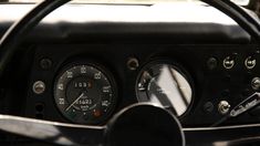 the gauges and dash board of an old car