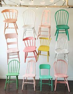 the chairs are all painted in different colors