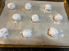 doughnuts on a baking sheet ready to go into the oven for making cookies