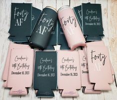 six pink and black can coolers with names on them