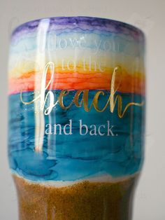 there is a coffee cup with the words love you to the beach and back on it