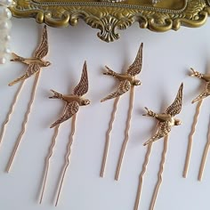 Gold Bird Hair Pins, perfect for a Wedding, bridesmaids, or any occasion. Made with KC gold birds and pins. Wonderful for a woodland themed Wedding. Stick pins are perfect for an up-do hairstyle.   Measures 3 1/2" (including pin) and birds measure 1 1/2" x 1"  Thank you for visiting Love Forever Bridal and please ask me any questions. Thanks so much! :) Bird Hair Pin, Angel Wings Hair, Woodland Themed Wedding, Bird Themed Wedding, Hat Ornaments, Hair Clips Wedding, Gold Birds, Bird Accessories, Hair Hat