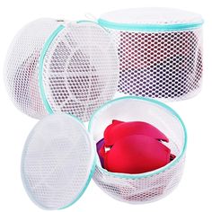 three mesh storage baskets filled with hats and other items, one red hat in the middle