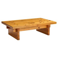 a wooden coffee table sitting on top of a white background