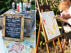 a man and woman are painting on an easel next to a chalkboard sign