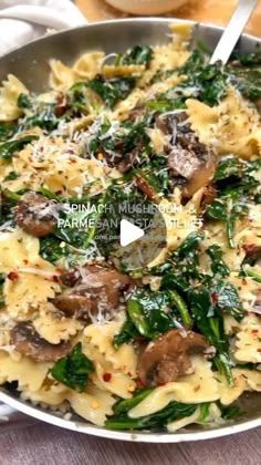 pasta with mushrooms and spinach in a pan