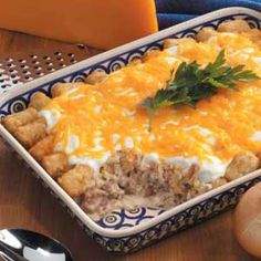 a casserole dish with meat and cheese on it