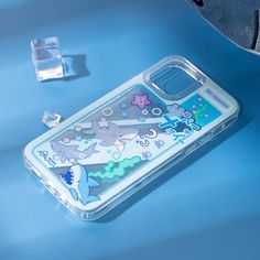 an image of a phone case on a blue surface with other items around it and a toothbrush