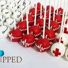 many red and white lollipops with medical symbols on them