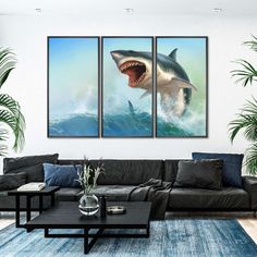 a living room filled with furniture and two paintings on the wall, one shark jumping out of the water