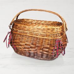 a wicker basket sitting on top of a white counter