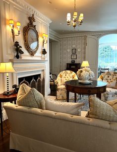 a living room filled with furniture and a fire place