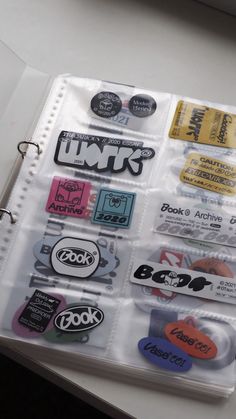 a binder with various stickers on it