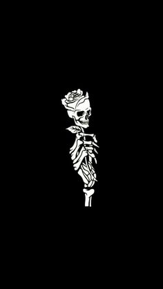 a skeleton holding a rose in its hand on a black background with the word love written below it