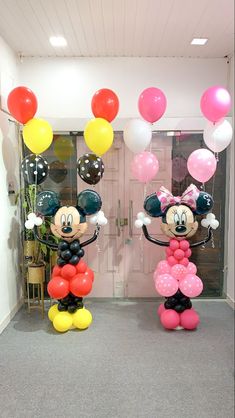 mickey and minnie balloon decorations in an office