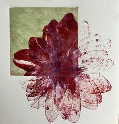 a piece of paper that has been altered to look like a flower with red and white petals