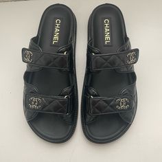 Gorgeous Coveted “Dad” Sandals Purchased At Bal Harbor Chanel Store On 7/5/2024 Worn Only Once And Are Slightly Large So Selling In Hopes Of Finding A Smaller Pair. Wear On Soles - Otherwise Pristine Condition. Just Trying To Make My Money Back (Or Close). Comes With Authenticity Cards/Box/Dust Bags/Receipt. Black Open Toe Slides With Padded Heel, Luxury Slides With Padded Heel, Classic Black Slides With Rubber Sole, Designer Slides With Leather Footbed And Round Toe, Designer Slides With Round Toe And Leather Footbed, Classic Black Sandals With Open Heel, Classic Black Slides With Flat Heel, Classic Black Sandals With Cushioned Footbed, Classic Black Flat Heel Slides