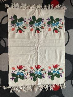 a piece of cloth with flowers on it