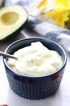 an avocado and yogurt in a blue bowl