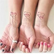 Mini Tattoos For Sisters 30+ to Choose From - Inspired Beauty Mom And Two Daughter Tattoos, 3 Person Tattoo, Sister Tattoos For 3 Meaningful, Sister Tattoos For 3, Pair Tattoos, Small Sister Tattoos, Sister Tattoo Designs, Sisters Tattoo, Tattoo Placements