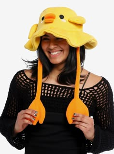 a woman wearing a yellow duck hat