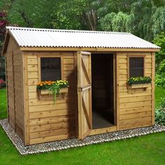 a small wooden shed with two doors and windows