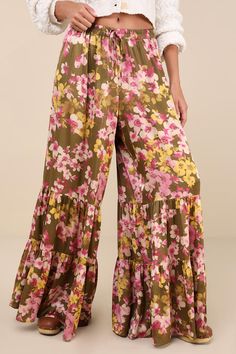 Weekends are for slow evenings and flawless looks like the Lulus Sweeter Sunsets Olive Green Floral Satin Tiered Wide-Leg Pants! Sleek woven satin, with a pink, ivory, and yellow-hued floral print throughout, shapes these breezy pants with a high-rise fit and an elasticized waistband with decorative drawstring ties. The wide pant legs boast a tiered silhouette before ending at full-length hems. Fit: This garment fits true to size. Length: Floor length. Size medium Inseam: 31.00 Front Rise: 13.50 Tiered Pants, Pink Ivory, Wide Pants, Leg Pants, Floor Length, Wide Leg Pants, Olive Green, Full Length, Wide Leg