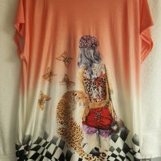 an orange shirt with a woman and a cat on it