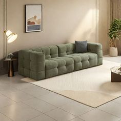 a living room with a couch, coffee table and potted plant in the corner