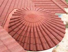 red clay roofing with circular design on top