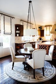 a dining room table and chairs in a kitchen