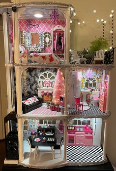 a doll house with all the furniture and accessories in it's display case,