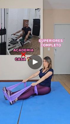 a woman sitting on the floor in front of a man doing exercises with an exercise wheel