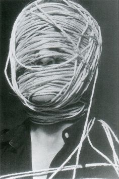 a woman with yarn wrapped around her head