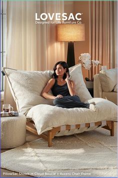 a woman sitting on top of a white couch