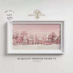 a white frame with pink houses and trees on it