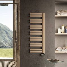 a bathroom with a wooden floor and wall mounted radiator next to a window