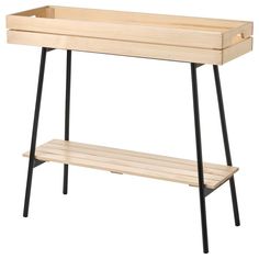 a wooden bench with black legs and a planter on the bottom one shelf is empty