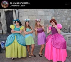 three women dressed in costumes posing for the camera