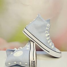 Brand New In Box Style #07216c Cloudy Daze/ White Add A Feminine Update To Your Sneaker Collection With The New Women's Blue Chuck Taylor All Star Flower Eyelet High Top Sneakers From Converse. Boasting Flower-Shaped Eyelets, A Durable Canvas Upper, And A High-Top Design, These Sneakers Seamlessly Blend Classic Style With Feminine Details For A Chic And Comfortable Statement. Canvas Upper High-Top Silhouette Lace-Up Front Closure Flower-Shaped Eyelets All Star Branding Woven Tongue Label Contras Light Blue High-top Sneakers For Spring, Light Blue Lace-up Sneakers For Spring, Trendy Light Blue Sneakers For Spring, Blue Lace-up Canvas Shoes For Spring, Light Blue Spring Sneakers, Blue Flat Canvas Shoes For Spring, Converse Sneakers For Spring, Trendy Light Blue Sneakers For Summer, Trendy Light Blue Summer Sneakers