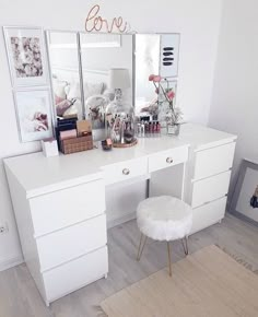 an image of a white dresser with mirror and stool on it's top shelf