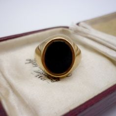 Vintage black onyx and 9k yellow gold signet ring.  In very good condition with light surface wear.  UK Size JP/Q - US Size 8 Hallmarked for 9k gold, Birmingham and stamped with maker's mark D&W. Weighs approx. 4 grams. Your ring will be sent gift wrapped - and boxes used in photos are for display purposes only and not included. Luxury Elegant Onyx Signet Ring, Luxury Black Collectible Signet Ring, Luxury Black Signet Ring Collectible, Luxury Modern Onyx Signet Ring, Luxury Black Art Deco Signet Ring, Luxury Onyx Signet Ring With Polished Finish, Luxury Onyx Signet Ring For Anniversary, Luxury Onyx Signet Ring For Anniversaries, Luxury Black Enamel Onyx Signet Ring